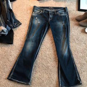 Silver jeans—twisted